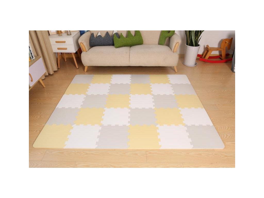 Rozložené žlté penové puzzle Kinderkraft Luno v detskej izbe